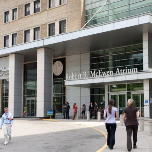 Hospital front entrance with people walking at University Health Network